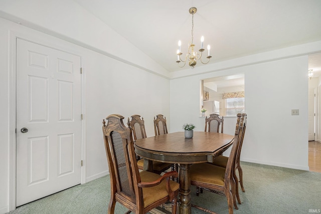 5843 Durham Ct, South Bend, IN 46614 - dining room with light carpet, a chandelier, vaulted ceiling, and baseboards