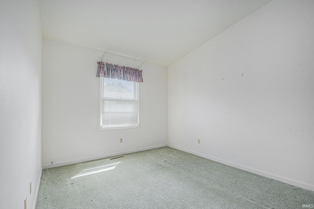 5843 Durham Ct, South Bend, IN 46614 - carpeted spare room with baseboards and vaulted ceiling