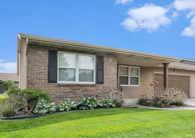 5843 Durham Ct, South Bend, IN 46614 - view of front facade featuring a garage, a front yard, brick siding, and driveway