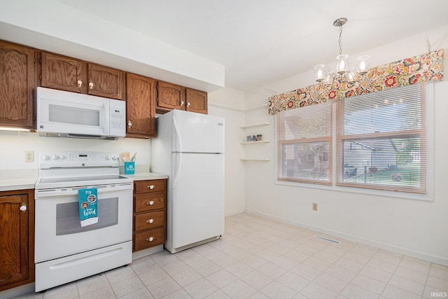 5843 Durham Ct, South Bend, IN 46614 - kitchen featuring white appliances, brown cabinetry, a chandelier, light countertops, and hanging light fixtures