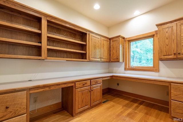 2557 S Smith Rd, Bloomington, IN 47401 - unfurnished office with built in desk, light wood-style flooring, and recessed lighting