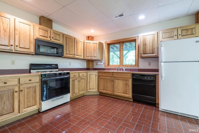 2557 S Smith Rd, Bloomington, IN 47401 - kitchen with black appliances, a sink, a drop ceiling, brick patterned flooring, and recessed lighting