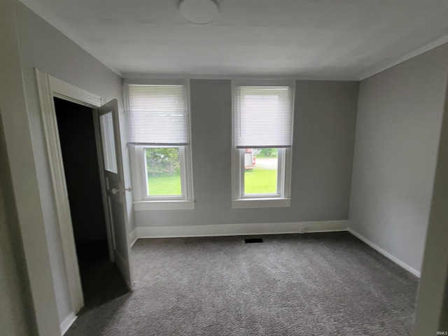 826 E Jefferson Blvd, Fort Wayne, IN 46803 - empty room featuring dark carpet and baseboards