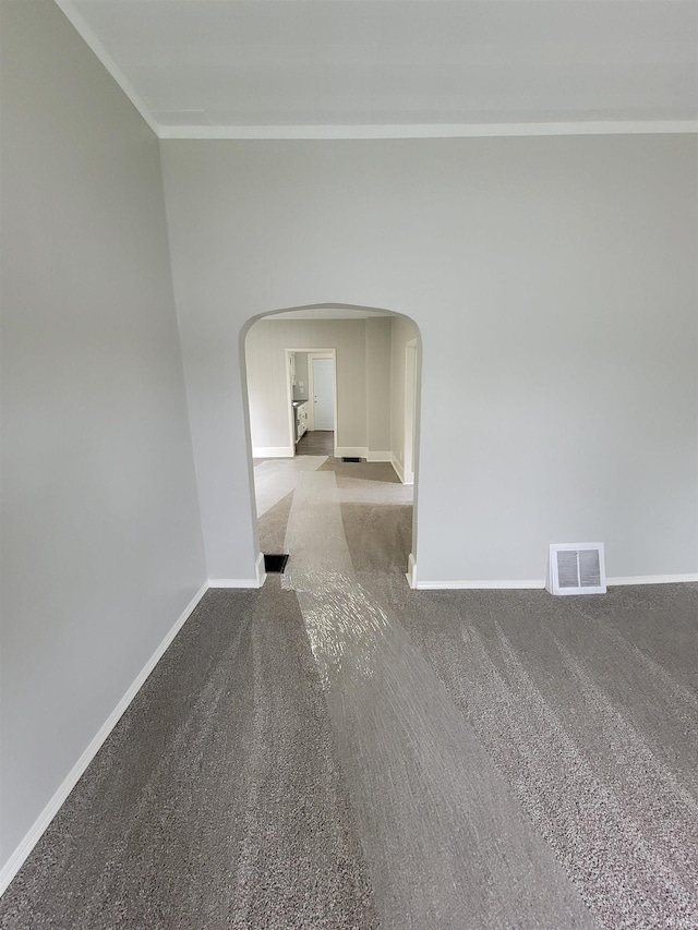 826 E Jefferson Blvd, Fort Wayne, IN 46803 - unfurnished room with arched walkways, ornamental molding, carpet floors, and baseboards