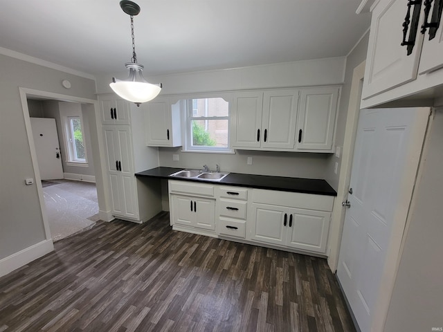 826 E Jefferson Blvd, Fort Wayne, IN 46803 - kitchen featuring a sink, dark countertops, dark wood-style flooring, plenty of natural light, and ornamental molding