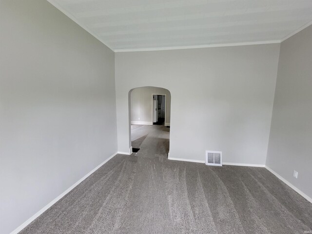 826 E Jefferson Blvd, Fort Wayne, IN 46803 - spare room with arched walkways, crown molding, dark colored carpet, and baseboards