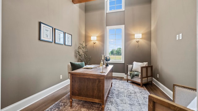 447 E Basalt Dr, Huntertown, IN 46748 - office area featuring dark wood finished floors, plenty of natural light, a towering ceiling, and baseboards