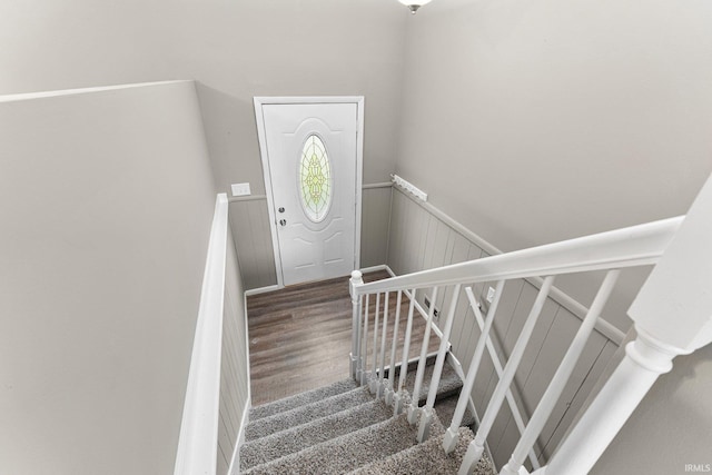 1024 Tulip Tree Rd, Fort Wayne, IN 46825 - staircase with a wainscoted wall and wood finished floors