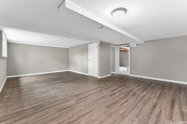 1024 Tulip Tree Rd, Fort Wayne, IN 46825 - finished below grade area with wood finished floors, concrete block wall, a textured ceiling, and baseboards