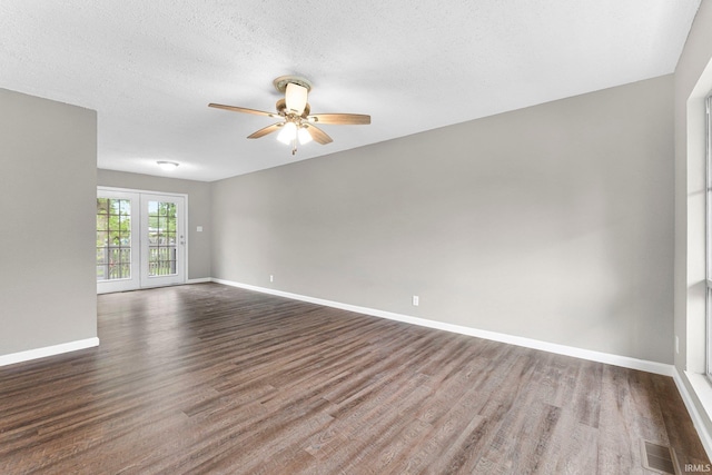1024 Tulip Tree Rd, Fort Wayne, IN 46825 - spare room with dark wood-type flooring, a ceiling fan, baseboards, and a textured ceiling