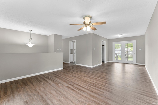 1024 Tulip Tree Rd, Fort Wayne, IN 46825 - spare room featuring baseboards, wood finished floors, and a ceiling fan