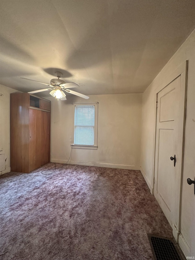 539 NE 9th St, Linton, IN 47441 - unfurnished bedroom featuring carpet flooring, ceiling fan, and baseboards