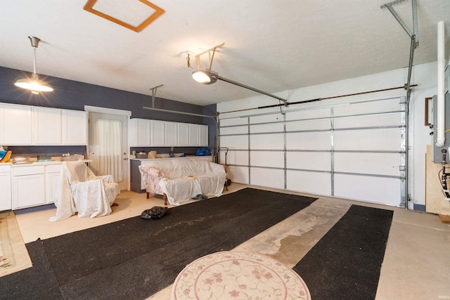404 S Maple St, Greentown, IN 46936 - garage featuring a garage door opener