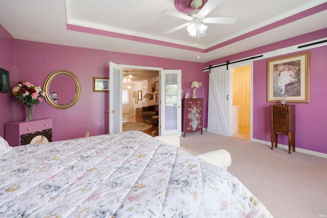 404 S Maple St, Greentown, IN 46936 - carpeted bedroom with a barn door, baseboards, ensuite bathroom, ornamental molding, and a ceiling fan