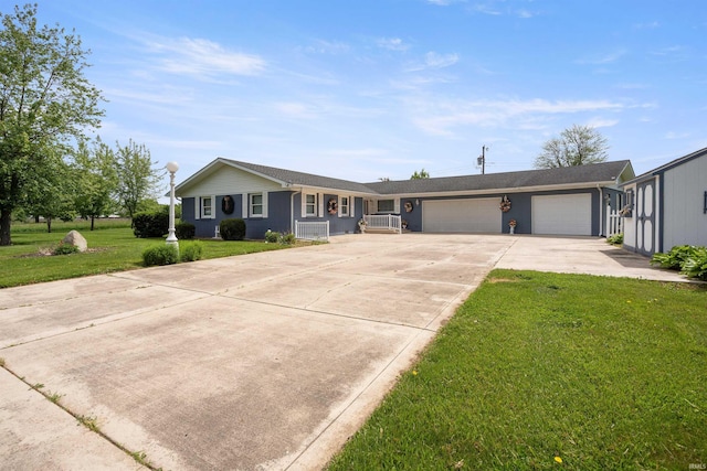 404 S Maple St, Greentown, IN 46936 - single story home with driveway, an attached garage, and a front lawn