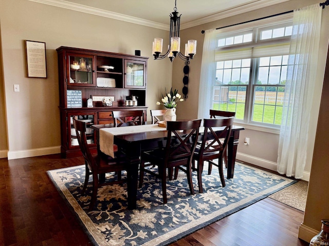 4968 W Campbell St, North Judson, IN 46366 - dining area with dark wood finished floors, baseboards, a chandelier, and crown molding