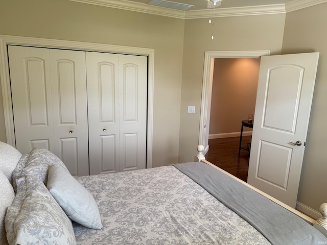 4968 W Campbell St, North Judson, IN 46366 - bedroom with a closet, baseboards, ornamental molding, and wood finished floors