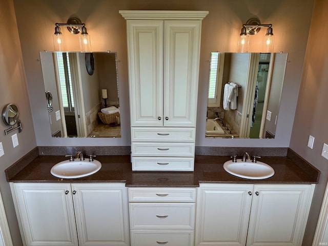4968 W Campbell St, North Judson, IN 46366 - bathroom featuring double vanity and a tub to relax in