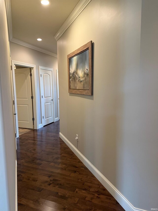 4968 W Campbell St, North Judson, IN 46366 - hallway featuring crown molding, baseboards, dark wood-type flooring, and recessed lighting