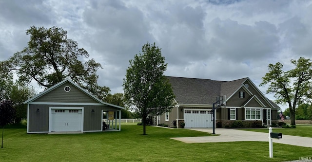 4968 W Campbell St, North Judson, IN 46366 - view of front of property featuring a front yard, concrete driveway, and board and batten siding