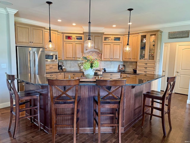 4968 W Campbell St, North Judson, IN 46366 - kitchen featuring appliances with stainless steel finishes, dark wood-style floors, a large island, glass insert cabinets, and ornamental molding