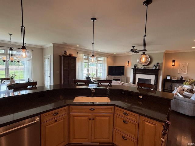 4968 W Campbell St, North Judson, IN 46366 - kitchen featuring dishwasher, open floor plan, a sink, a ceiling fan, and a fireplace