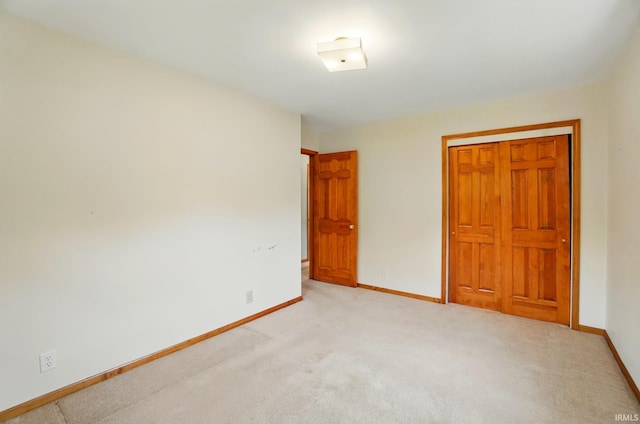 5415 Cranston Ave, Fort Wayne, IN 46835 - unfurnished bedroom with baseboards, light colored carpet, and a closet