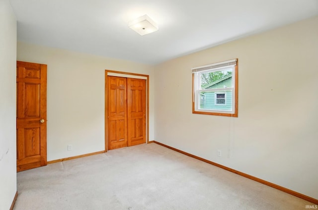 5415 Cranston Ave, Fort Wayne, IN 46835 - unfurnished bedroom with a closet, light carpet, and baseboards