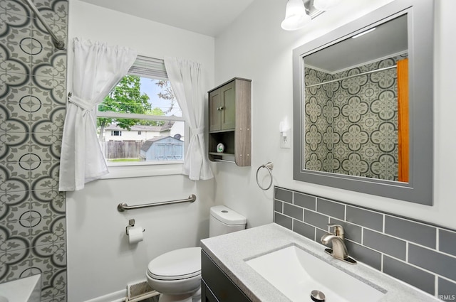 5415 Cranston Ave, Fort Wayne, IN 46835 - bathroom featuring backsplash, a shower, toilet, and vanity