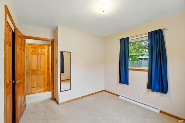 5415 Cranston Ave, Fort Wayne, IN 46835 - spare room featuring a baseboard heating unit, baseboards, and light colored carpet