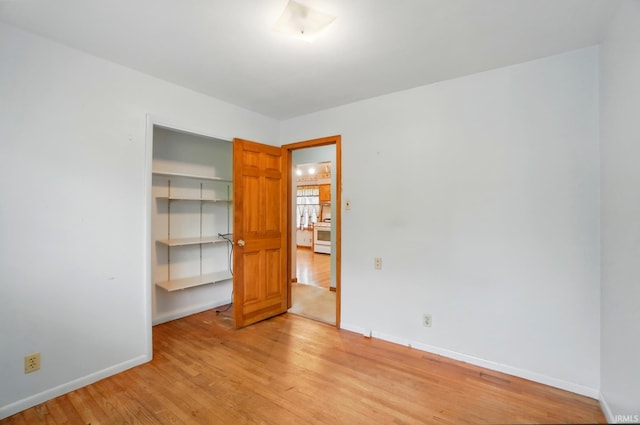 5415 Cranston Ave, Fort Wayne, IN 46835 - unfurnished bedroom with light wood-type flooring, a closet, and baseboards