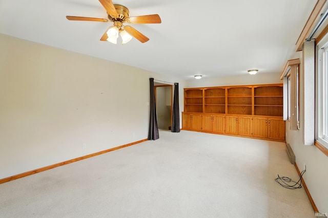 5415 Cranston Ave, Fort Wayne, IN 46835 - empty room featuring light carpet, baseboards, ceiling fan, and a baseboard radiator