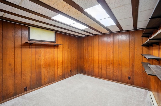 5415 Cranston Ave, Fort Wayne, IN 46835 - finished basement with carpet flooring, a baseboard heating unit, and wood walls