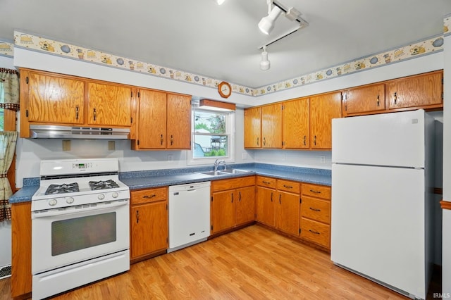 5415 Cranston Ave, Fort Wayne, IN 46835 - kitchen with white appliances, under cabinet range hood, a sink, and brown cabinetry
