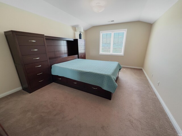 6359 E County Road 1900 N, Dale, IN 47523 - bedroom with vaulted ceiling, light carpet, and baseboards