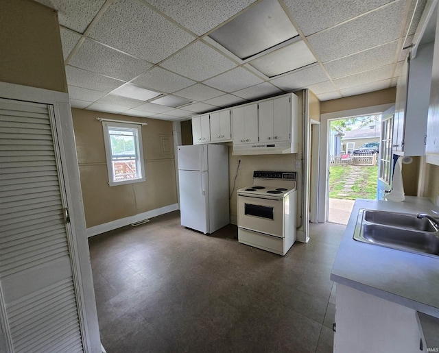 3403 Corbierre Ave, Evansville, IN 47712 - kitchen with white appliances, a sink, under cabinet range hood, white cabinets, and dark floors