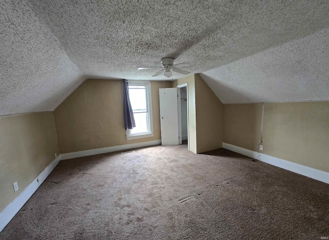 3403 Corbierre Ave, Evansville, IN 47712 - bonus room with a textured ceiling, vaulted ceiling, carpet floors, baseboards, and a ceiling fan