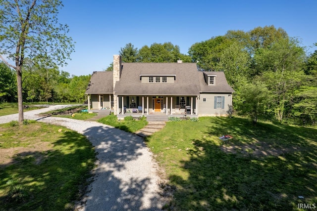 3638 N 1500 W Rd, Linton, IN 47441 - view of front of property with covered porch, a chimney, and a front lawn