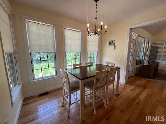 3638 N 1500 W Rd, Linton, IN 47441 - dining area featuring a chandelier, hardwood / wood-style floors, and baseboards