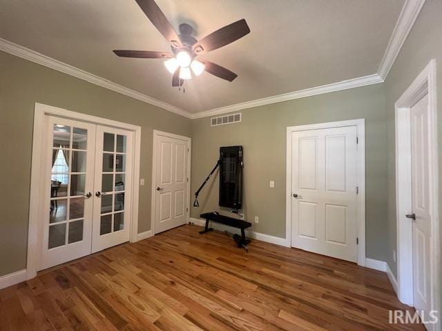 3638 N 1500 W Rd, Linton, IN 47441 - workout area featuring french doors, wood finished floors, crown molding, baseboards, and a ceiling fan