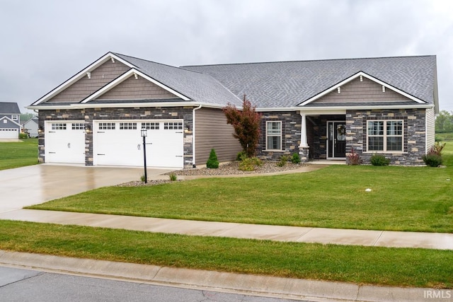 12475 Speranza Dr, Fort Wayne, IN 46818 - craftsman-style home featuring stone siding, an attached garage, concrete driveway, a front yard, and a shingled roof