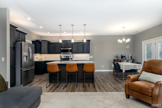12475 Speranza Dr, Fort Wayne, IN 46818 - kitchen featuring open floor plan, appliances with stainless steel finishes, recessed lighting, a chandelier, and dark wood finished floors