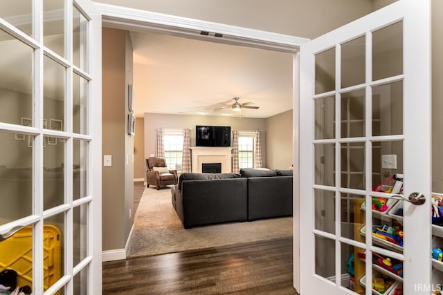 12475 Speranza Dr, Fort Wayne, IN 46818 - living area with french doors, a ceiling fan, wood finished floors, and baseboards