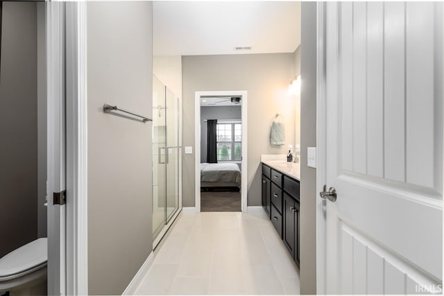 12475 Speranza Dr, Fort Wayne, IN 46818 - ensuite bathroom featuring a shower stall, toilet, vanity, and tile patterned floors