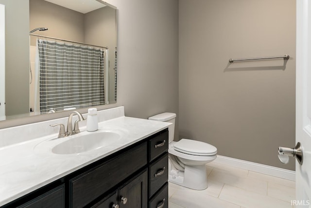 12475 Speranza Dr, Fort Wayne, IN 46818 - bathroom featuring toilet, vanity, a shower with shower curtain, tile patterned floors, and baseboards