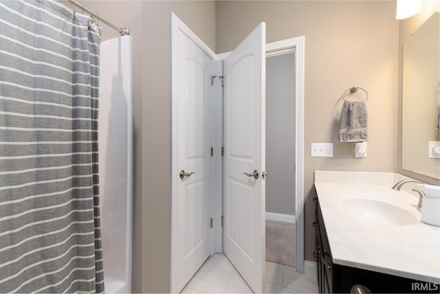 12475 Speranza Dr, Fort Wayne, IN 46818 - bathroom featuring vanity, tile patterned floors, baseboards, and a shower with curtain