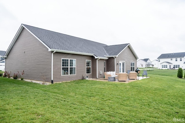 12475 Speranza Dr, Fort Wayne, IN 46818 - rear view of house with an outdoor hangout area, a patio, a yard, and a shingled roof