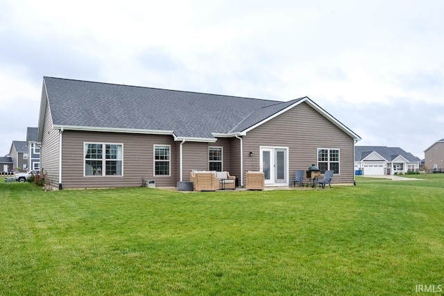 12475 Speranza Dr, Fort Wayne, IN 46818 - rear view of property featuring outdoor lounge area, a yard, a patio, and a shingled roof