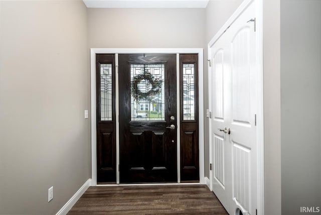 12475 Speranza Dr, Fort Wayne, IN 46818 - foyer featuring dark wood-type flooring and baseboards