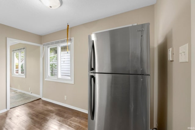 1510 W 4th St, Fort Wayne, IN 46808 - kitchen with freestanding refrigerator, wood finished floors, and baseboards